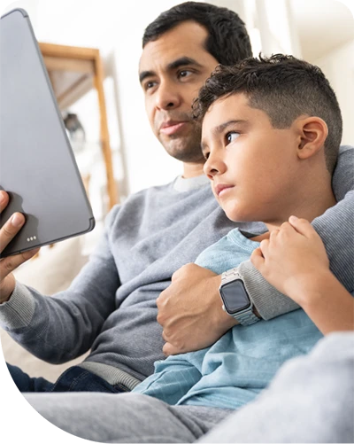 Father and sone looking at tablet