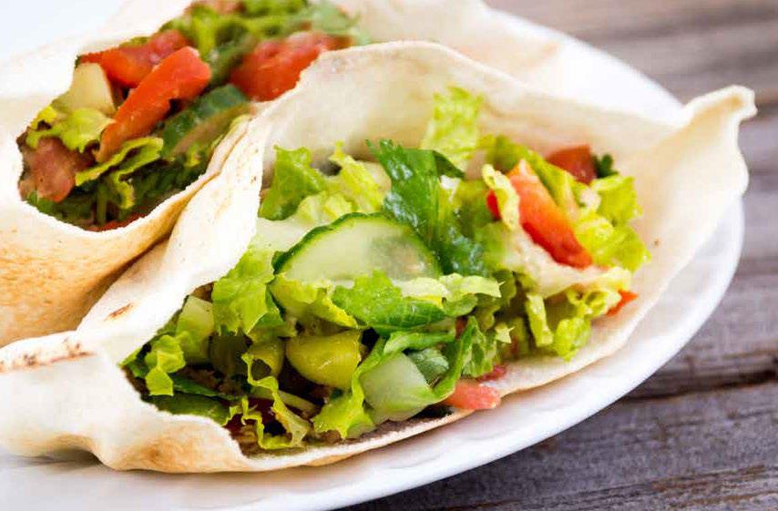 Veggie pita pocket with hummus