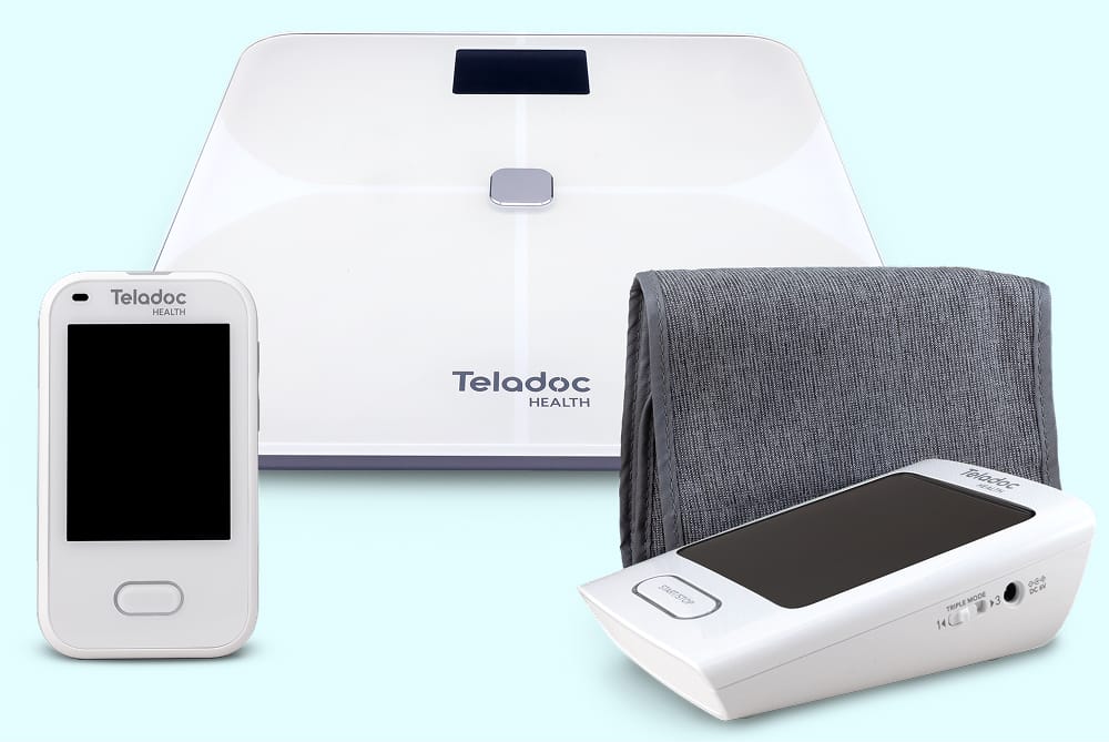 A Teladoc Health smart scale, glucose meter reader, and blood pressure monitor with cuff, grouped together.