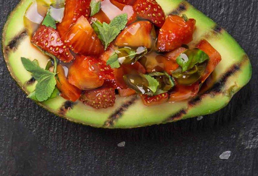 Grilled avocado with strawberry and honey