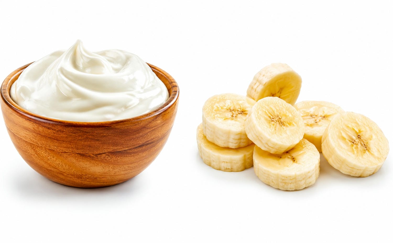 Greek yogurt in a bowl and some banana slices