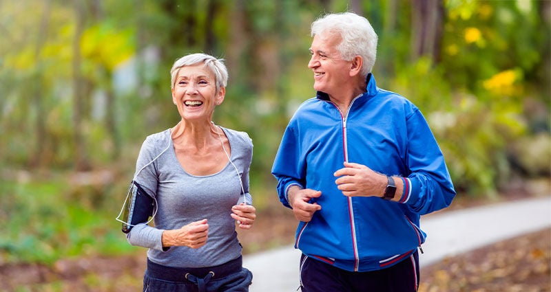 Older white couple enjoying fitness.