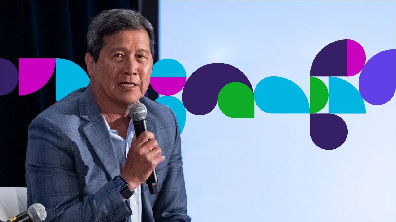 Forum panelist speaking into microphone