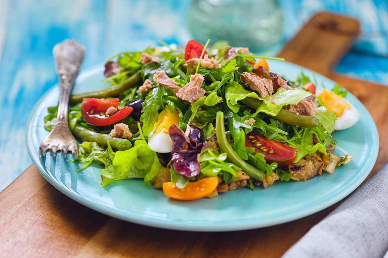 Salad with tuna, green beans, boiled eggs, potatoes and tomatoes.