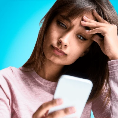 Woman booking a virtual therapy session on her phone
