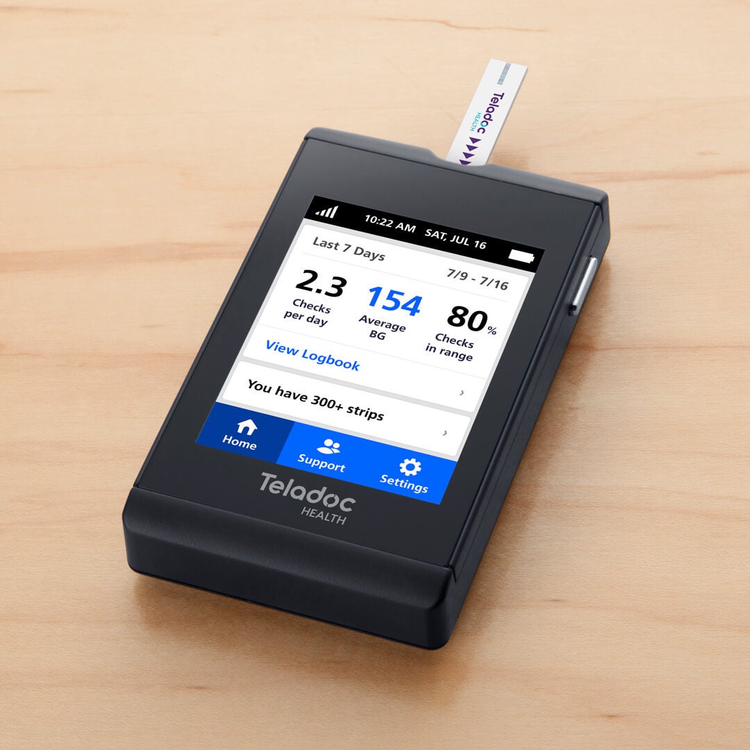 BG300 blood glucose meter, turned on with a test strip in it