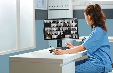 Provider holding a tablet with a brain scan 