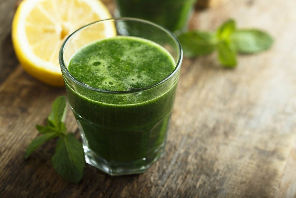 Healthy freshly made green smoothie with spinach and kale
