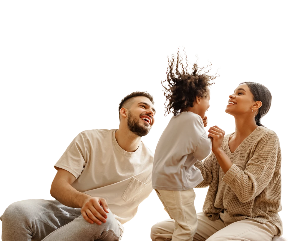 Parents laughing and playing with their child