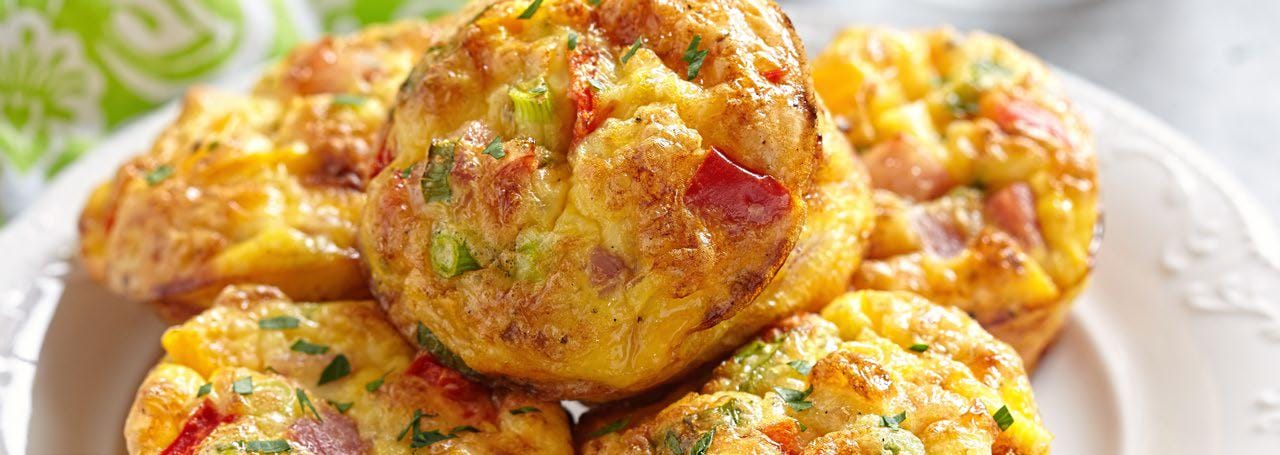 A plate stacked with egg veggie muffins