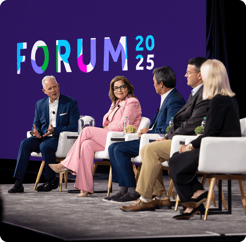 A group of speakers having a discussion at the Forum 2025 event.