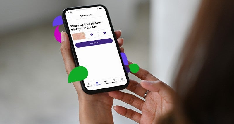A person holding a smartphone displaying a medical app interface for sharing up to three photos with a doctor.