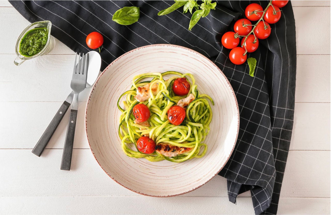 Zoodles dish with chicken and tomatoes.