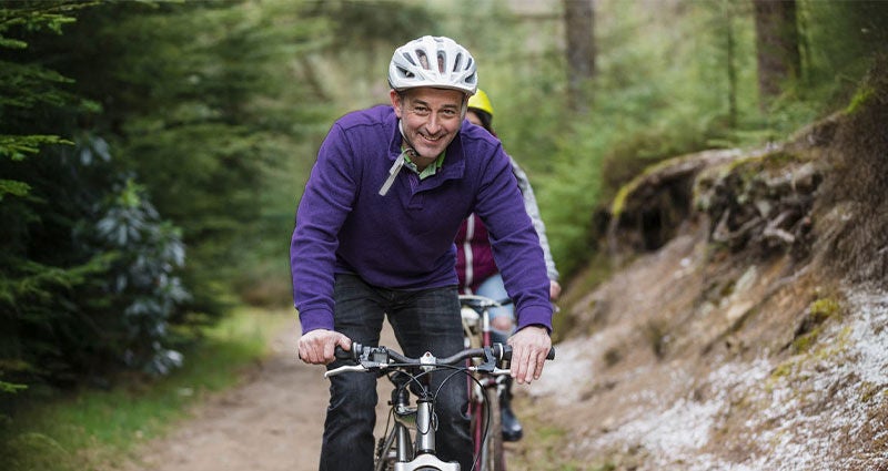 Man riding bicycle outdoors. 