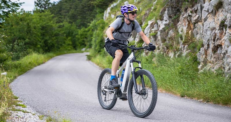 Man riding a bike on a mountain