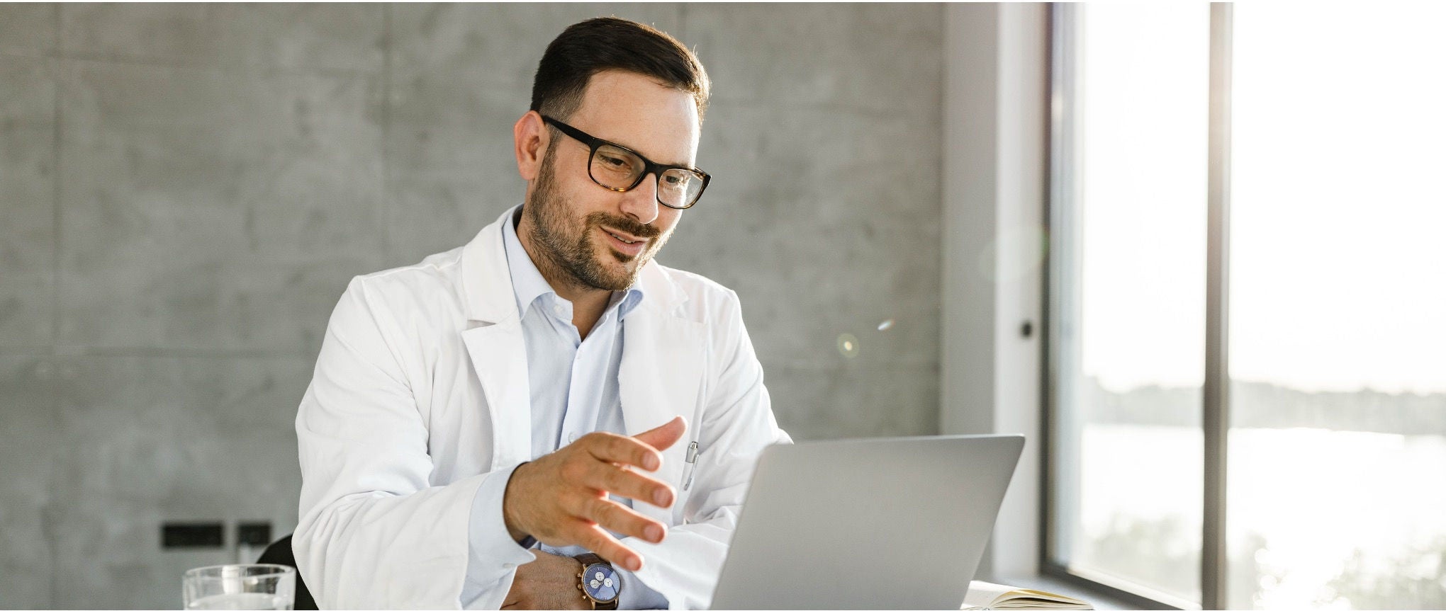Healthcare leader reviewing a digital strategy dashboard for enterprise virtual care.