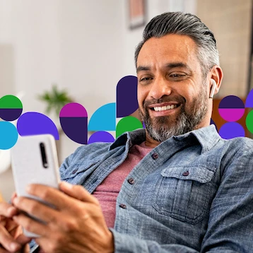 Middle-aged men smiling at her phone