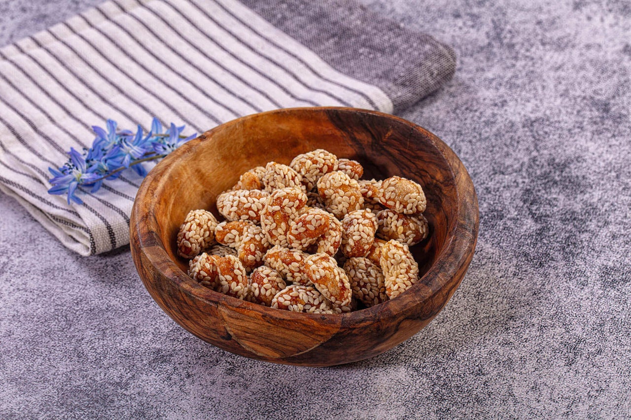 Bowl of sesame seed coated cashews.