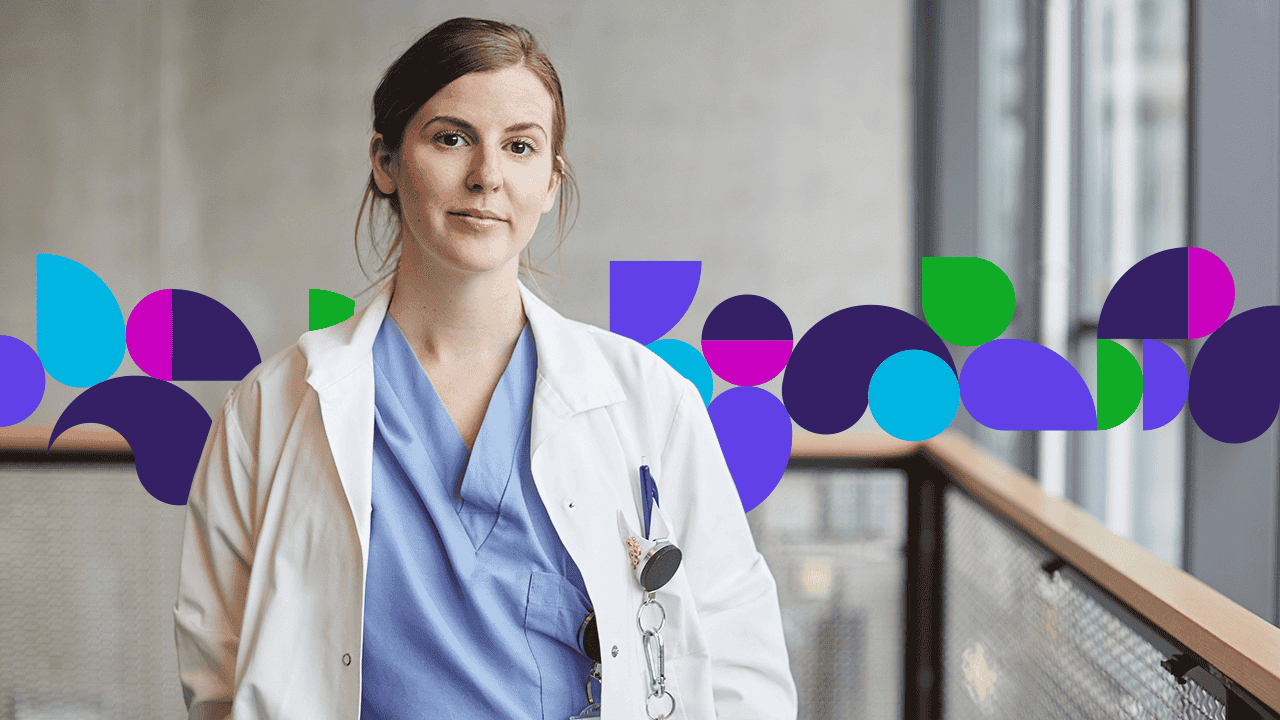 Doctor standing in hallway smiling