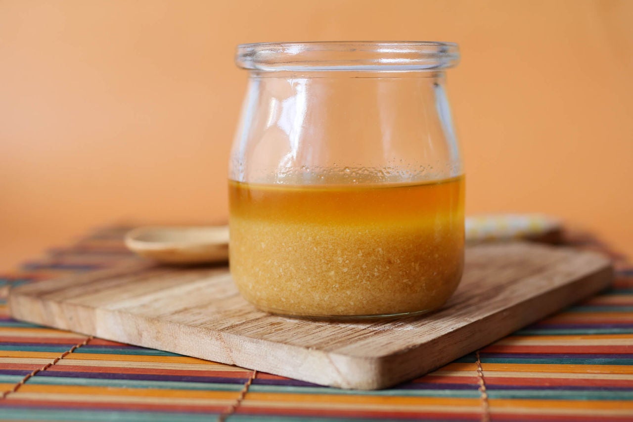 Ginger dressing with oil on top in a small jar.