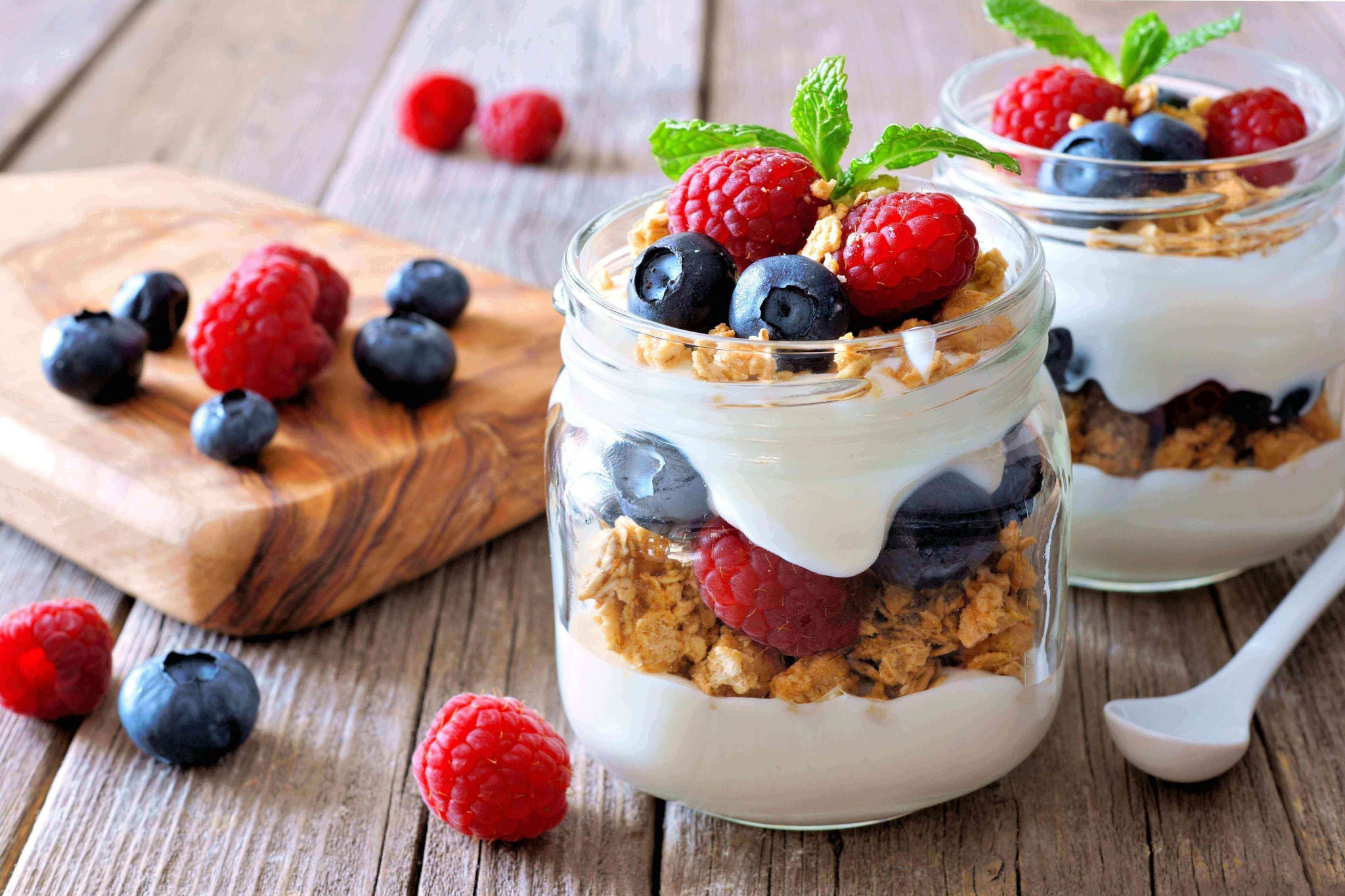 Cup with layers of yogurt, fruit and granola.