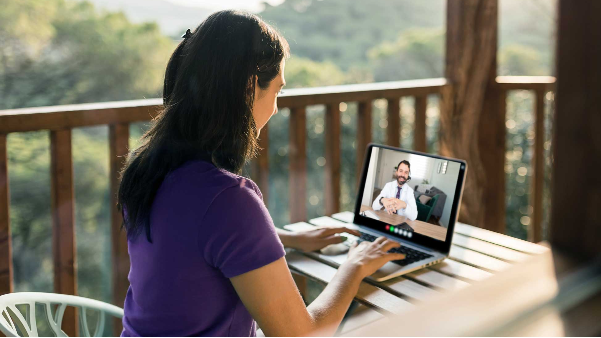 Doctor meeting remotely with his patient