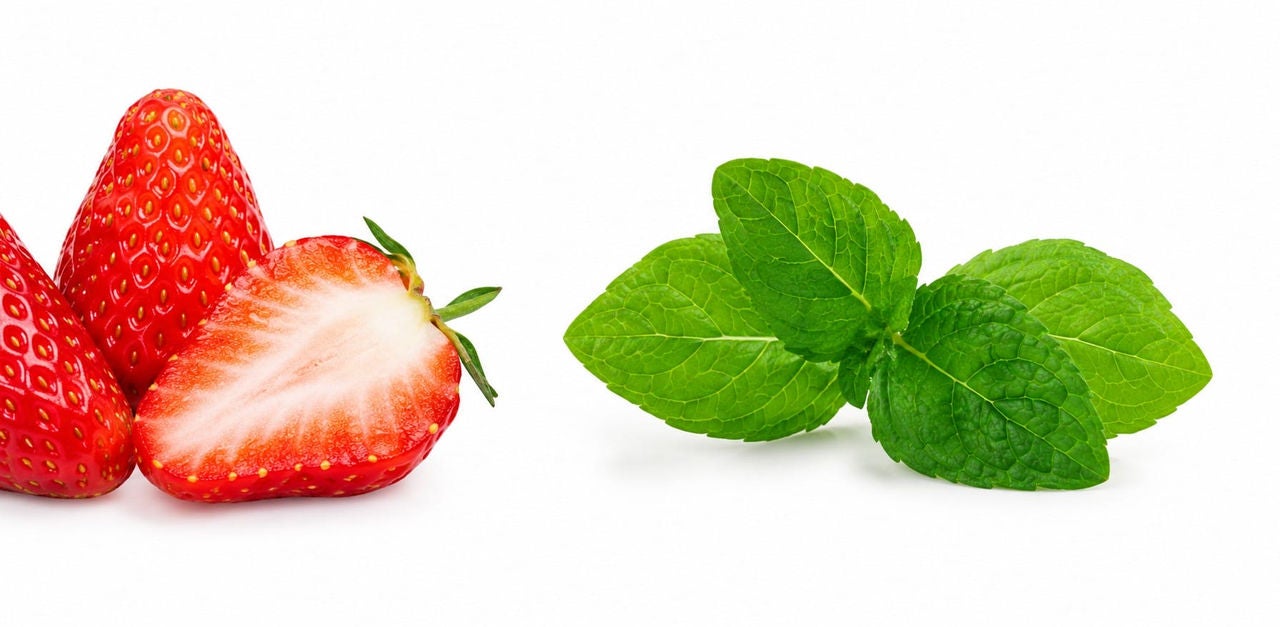 Sliced strawberries and basil leaves