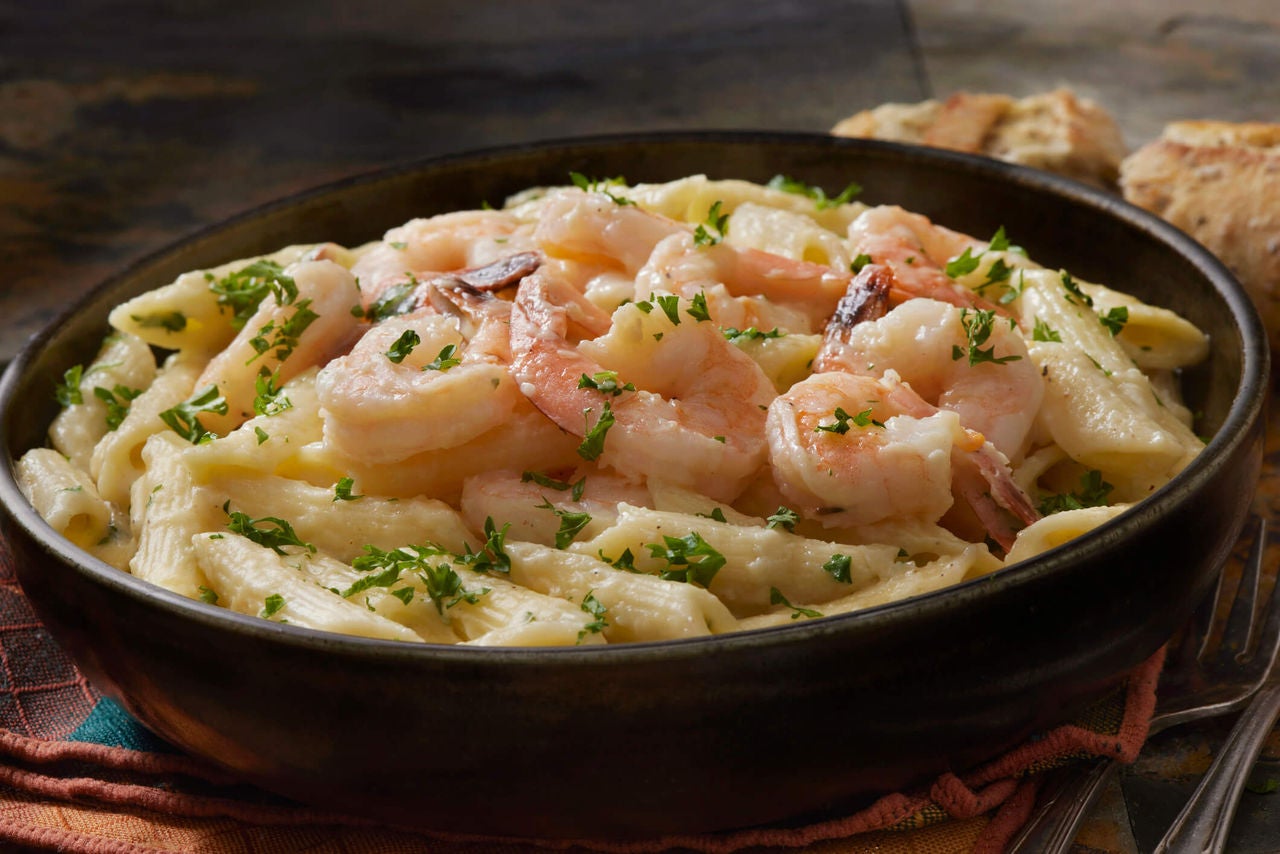 Penne pasta with herbs and shrimp.