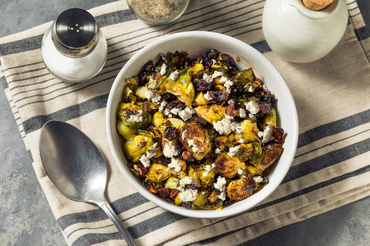 Brussel sprouts salad with chopped up dried dates and crumbled feta cheese.