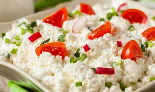 Savory cottage cheese with tomatoes in a bowl