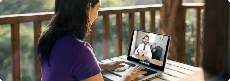 Doctor meeting remotely with his patient