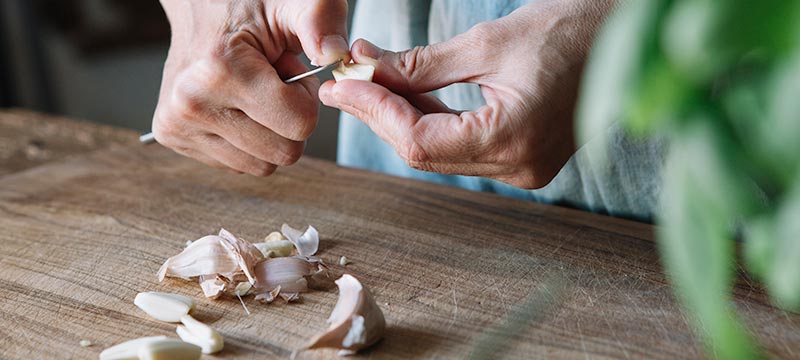Garlic cloves being peeled