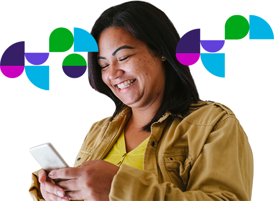 Woman smiling while looking at her phone