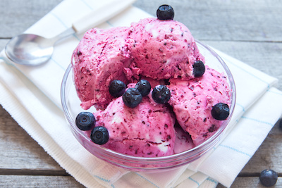 Healthy homemade raw vegan banana and berry ice cream (icecream, nicecream) topped with organic blueberries - healthy vegetarian diet vegan raw fruit organic delicious dessert, dairy free, gluten free