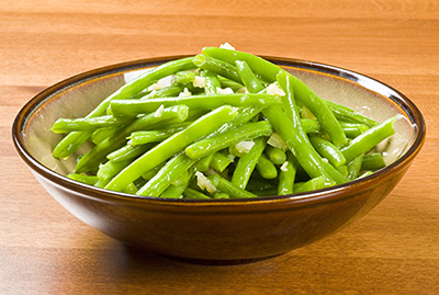 Bowl of Cooked Green Beans and Garlic