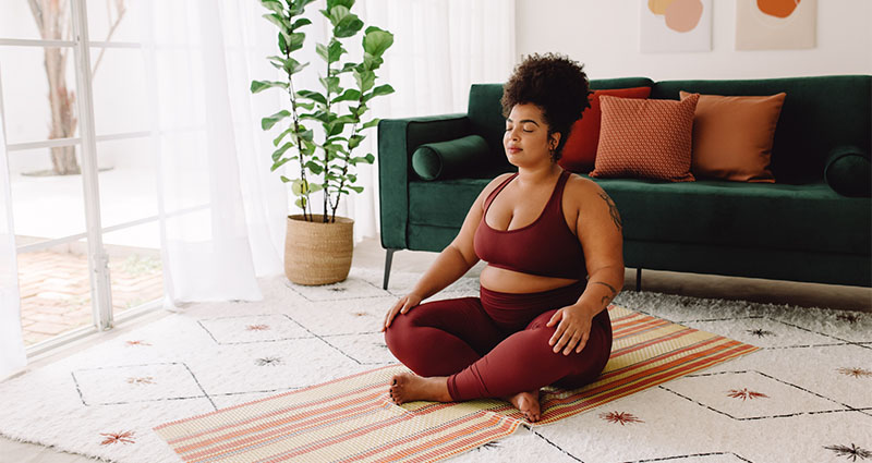 Lady doing yoga, eyes closed