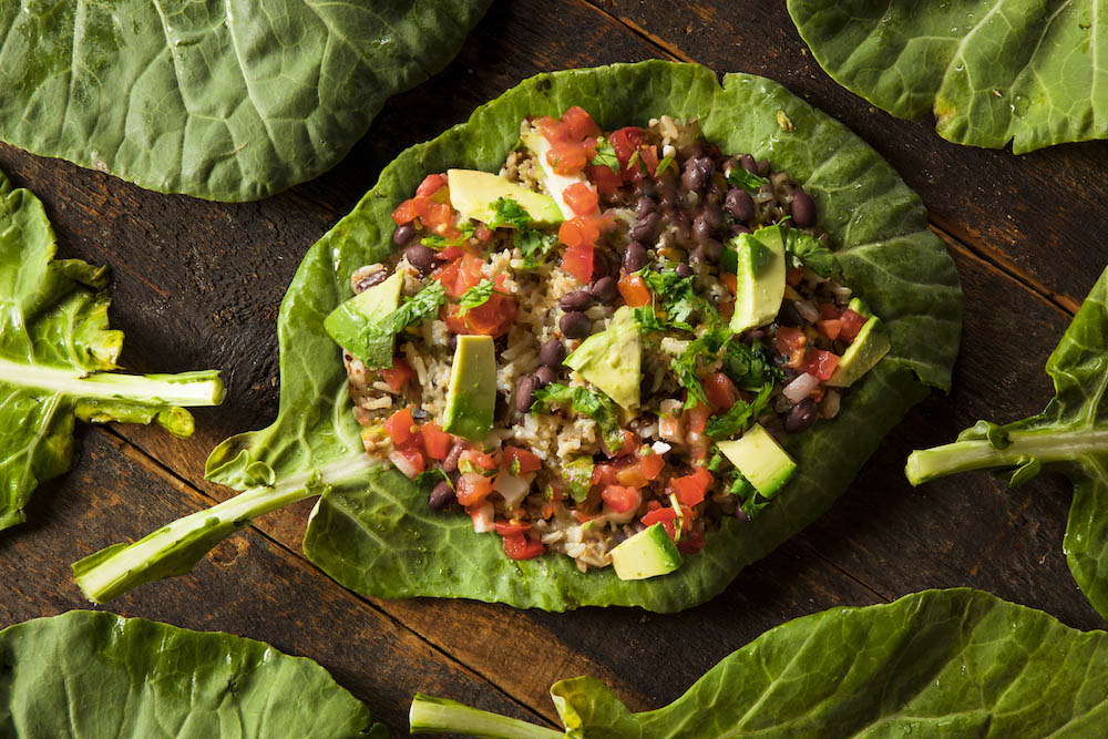 Raw Organic Green Collard Greens on a Background