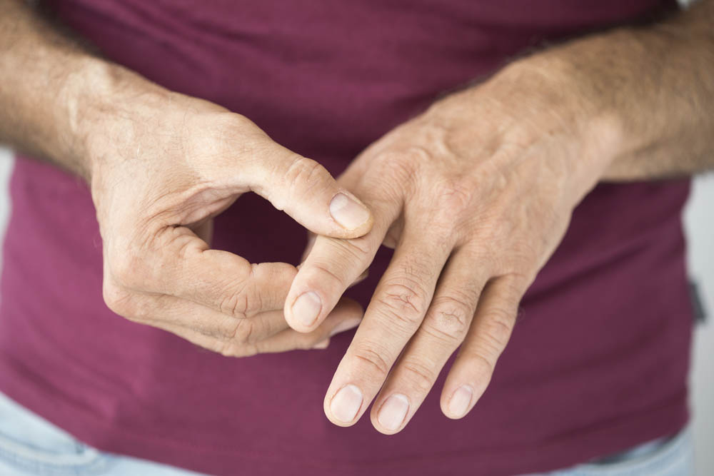 Close-up of a person rubbing their finger