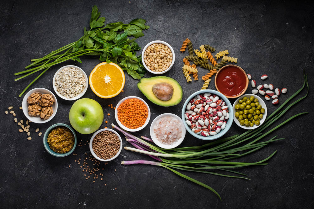 Healthy diet food. Top view. Small round plates with different products in it. Fresh seasonal fruts and vegetables.