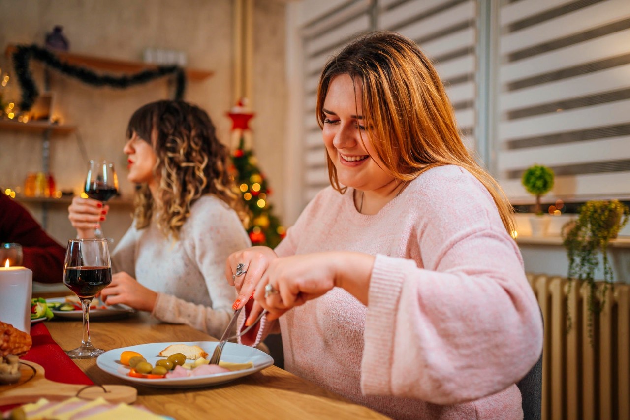 Lady eating at a holiday event