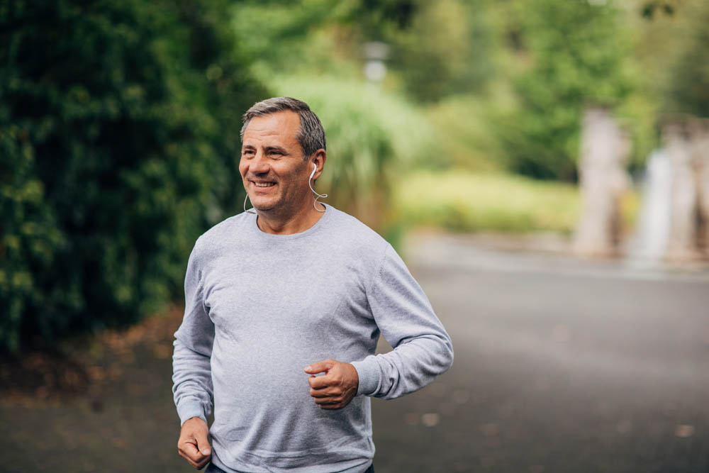 Mature/senior man jogging in park
