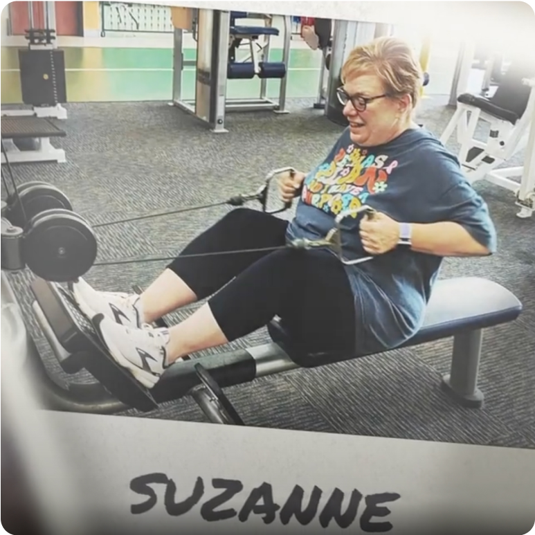 Woman with short hair and glasses on exercise machine