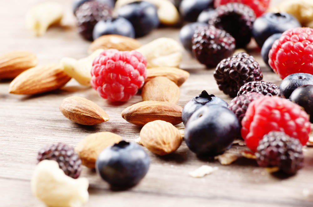 Nuts and berries on the wooden table