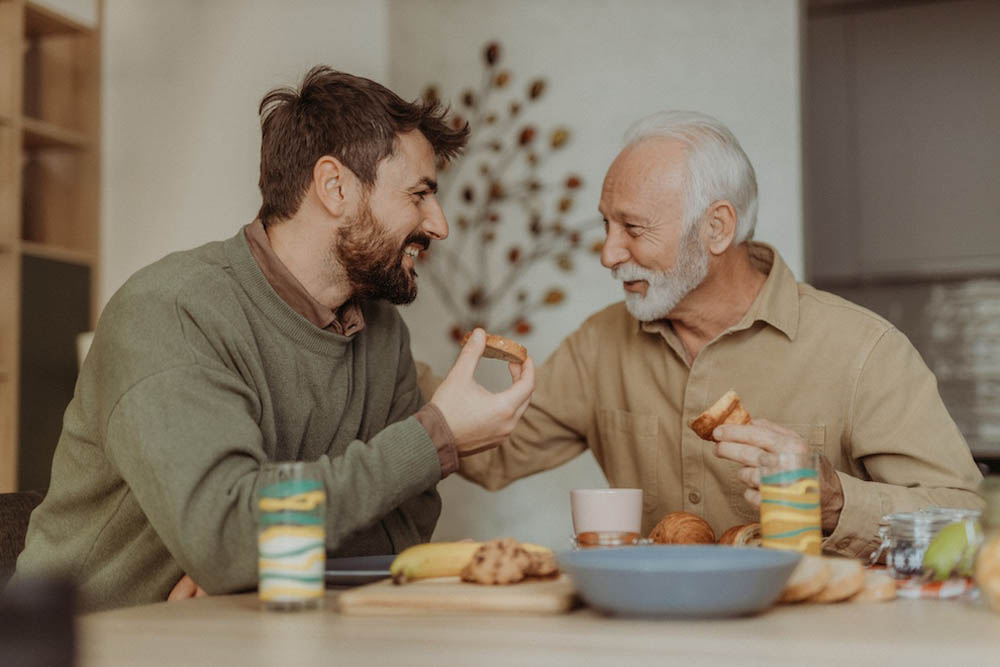 Father and son having breakfast