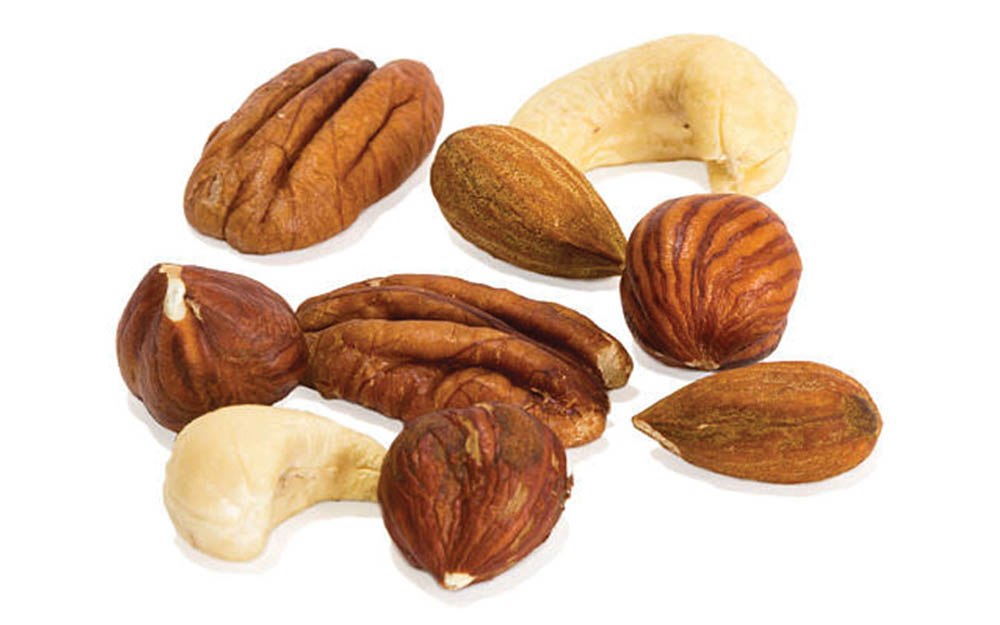 Assorted mixed nuts including pecans, cashews, hazelnuts, and almonds