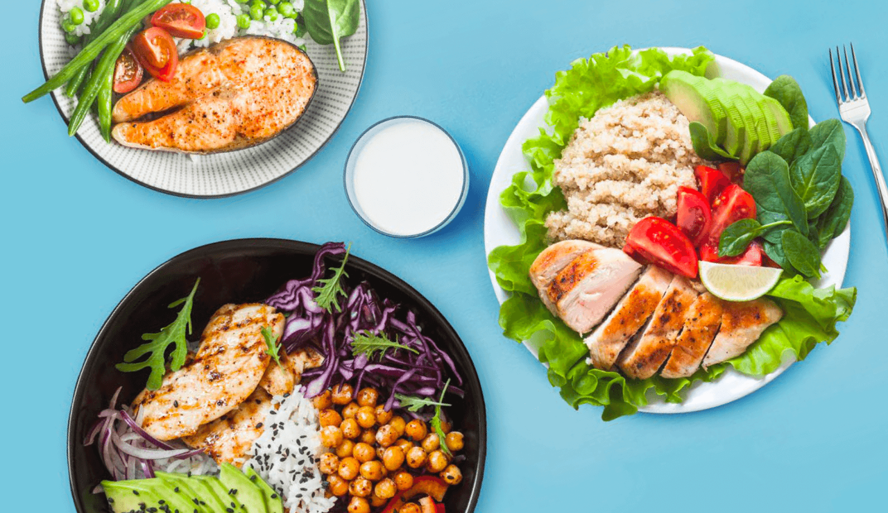 Three healthy, balanced meals featuring grilled chicken, fresh vegetables, and nutritious sides, arranged on a blue background.