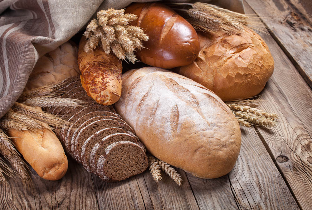 Bread and ears on an old table.