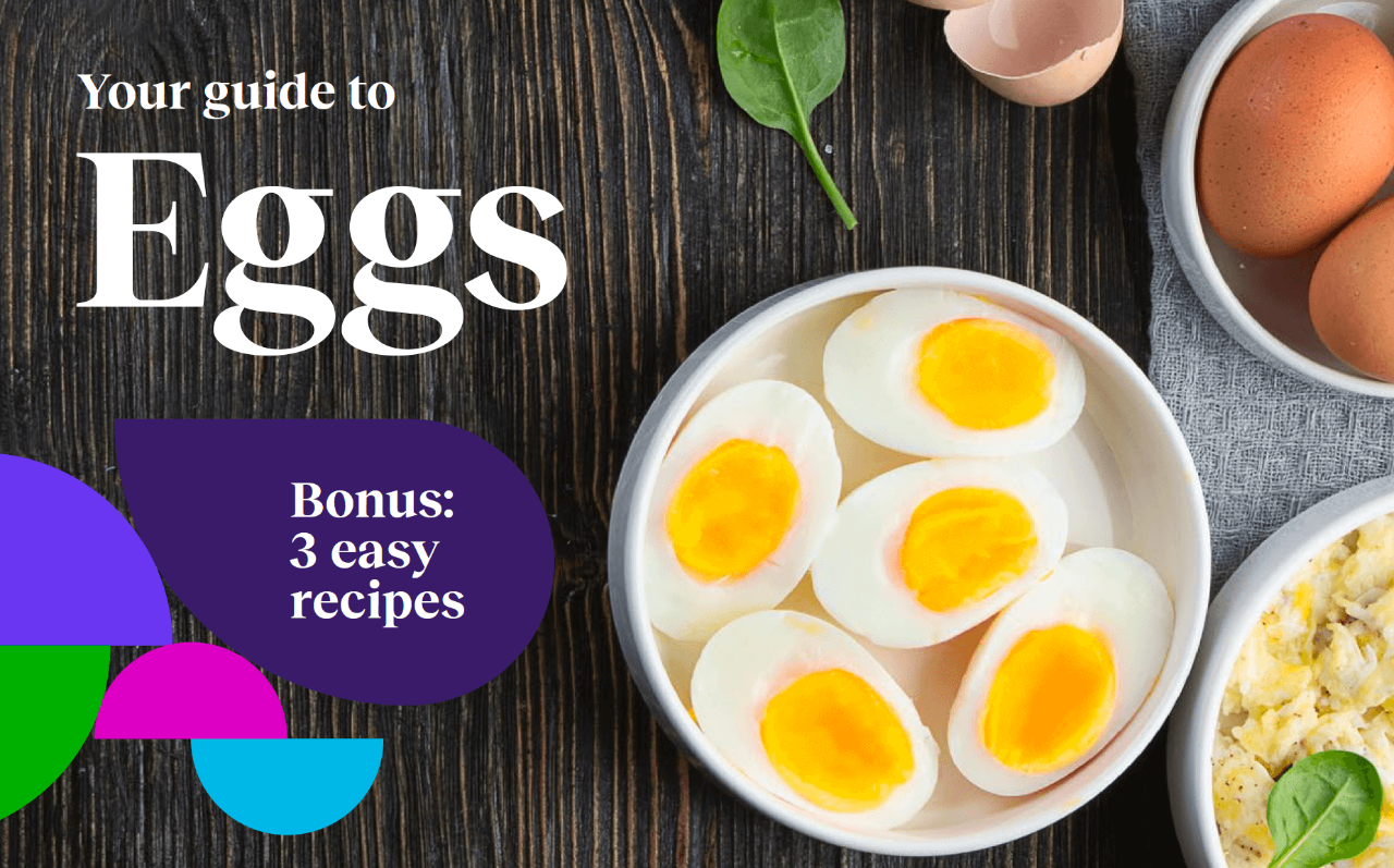 A bowl of half-sliced boiled eggs placed on a wooden table. Text: Your guide to Eggs. Bonus: 3 easy recipes.