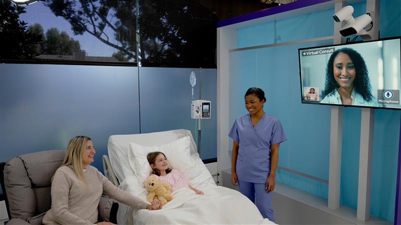 Mother and child talking with medical professional through video call