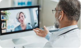 Doctor meeting remotely with his patient